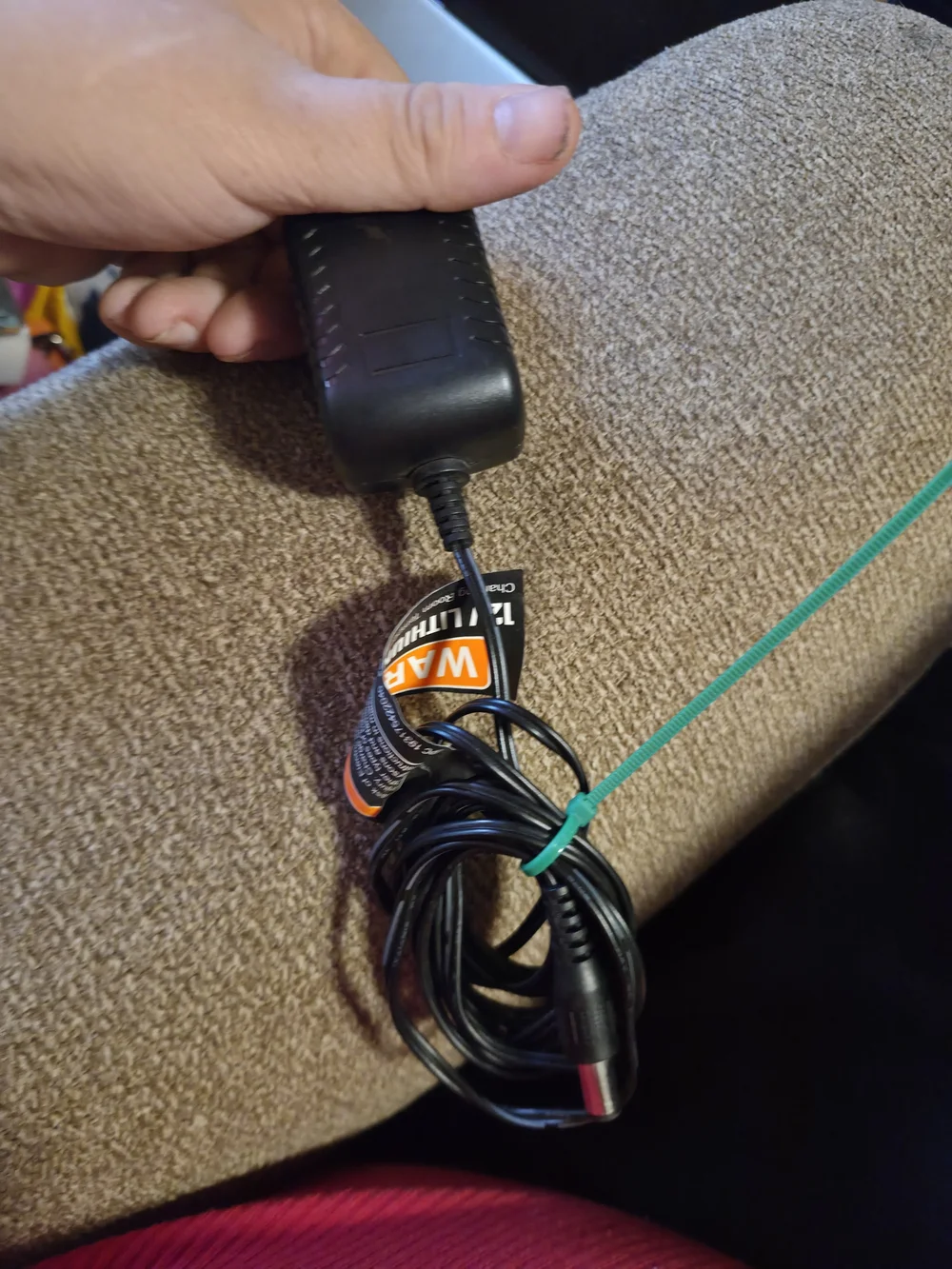 black AC adapter for a Remington charging cord, intended for use with various MB